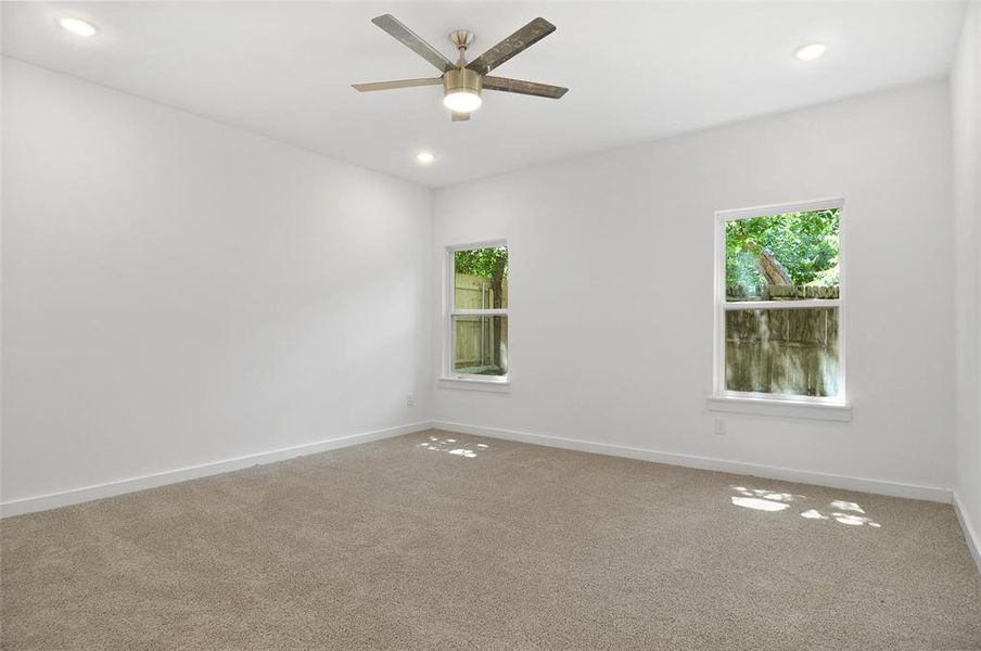 Unfurnished room with carpet and ceiling fan