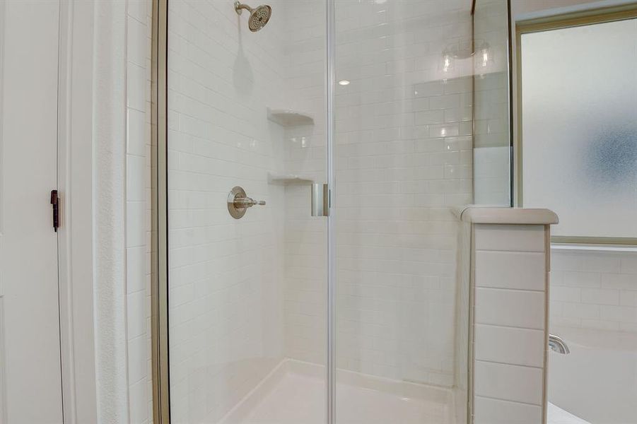 Bathroom featuring a shower with shower door