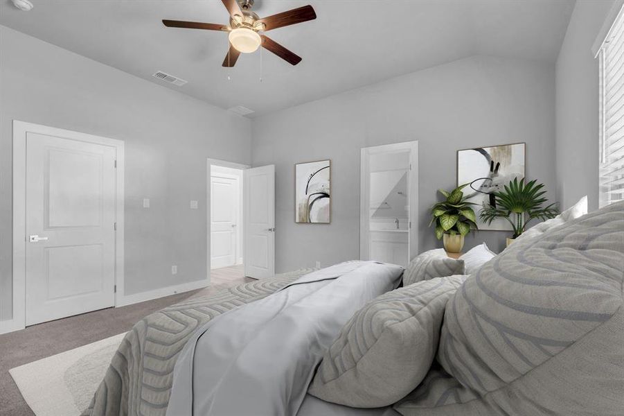 Bedroom featuring light carpet, vaulted ceiling, ceiling fan, and ensuite bathroom