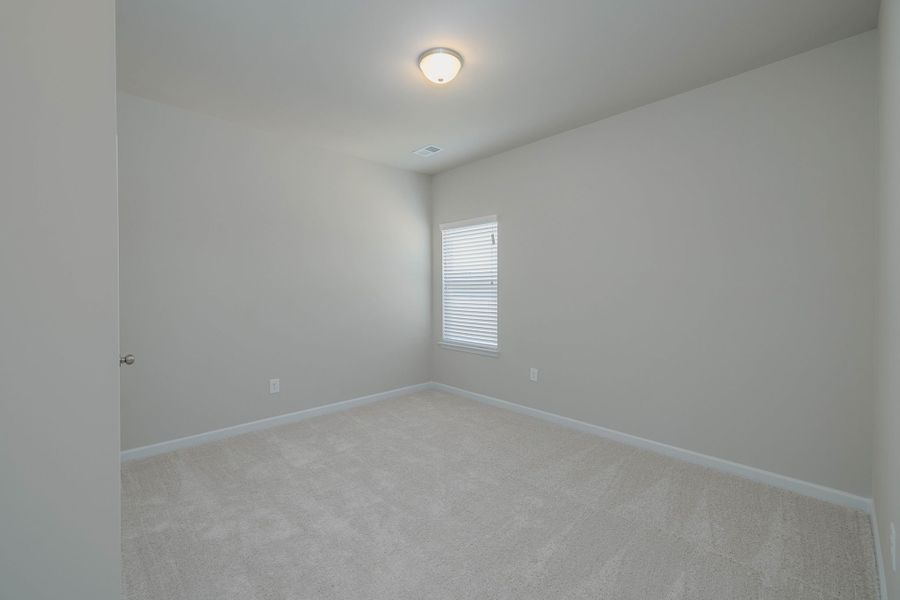 Bedroom 3 with easy access to laundry room