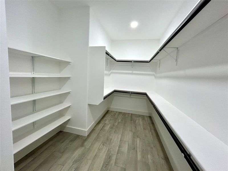 Walk-in closet in the primary bathroom.