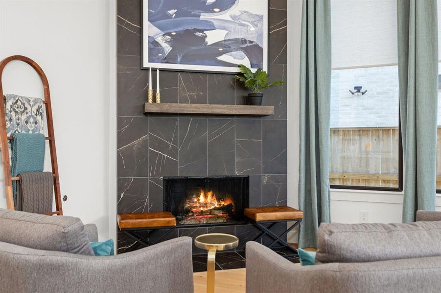 The beautiful marble fireplace is a statement all on its own.