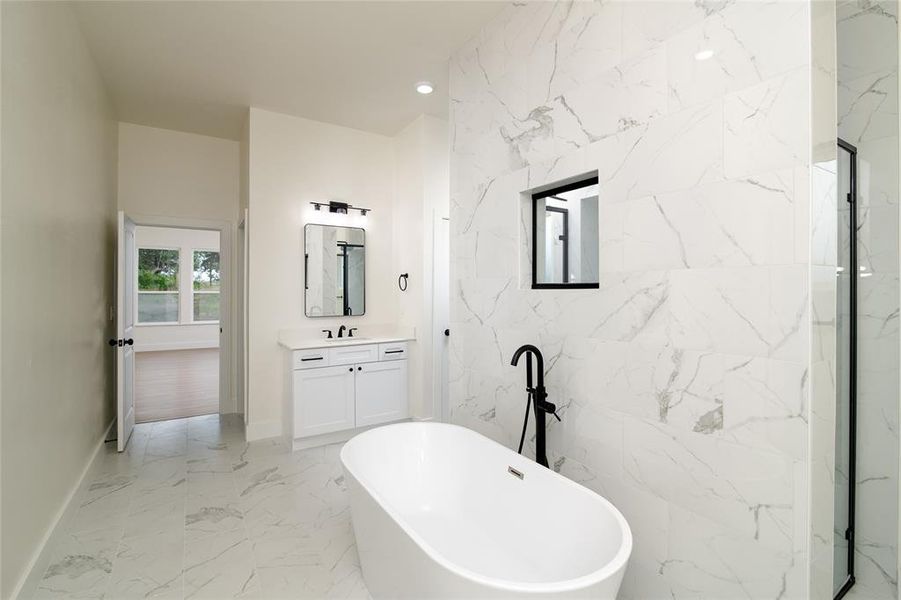 Master Bathroom with vanity and separate shower and tub