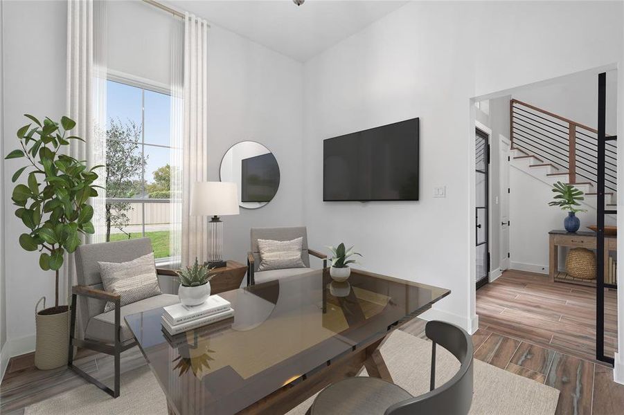 Virtually staged. Discover a tranquil retreat in the study, strategically placed in the front of the house to capture abundant natural light. The high ceilings enhance the spacious feel, while the steel barn door adds a touch of contemporary elegance to this inspiring workspace.