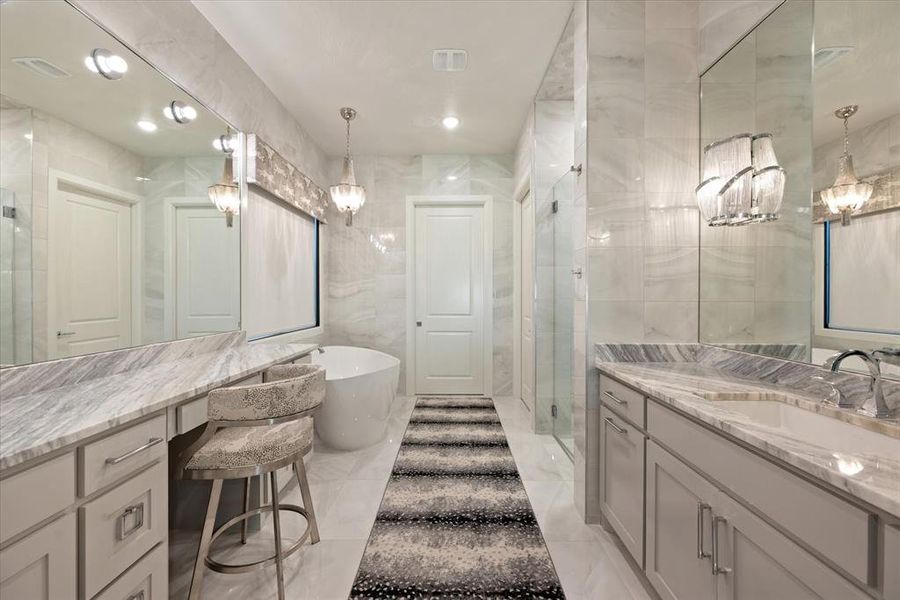 Bathroom featuring tile walls, independent shower and bath, tile patterned floors, and vanity