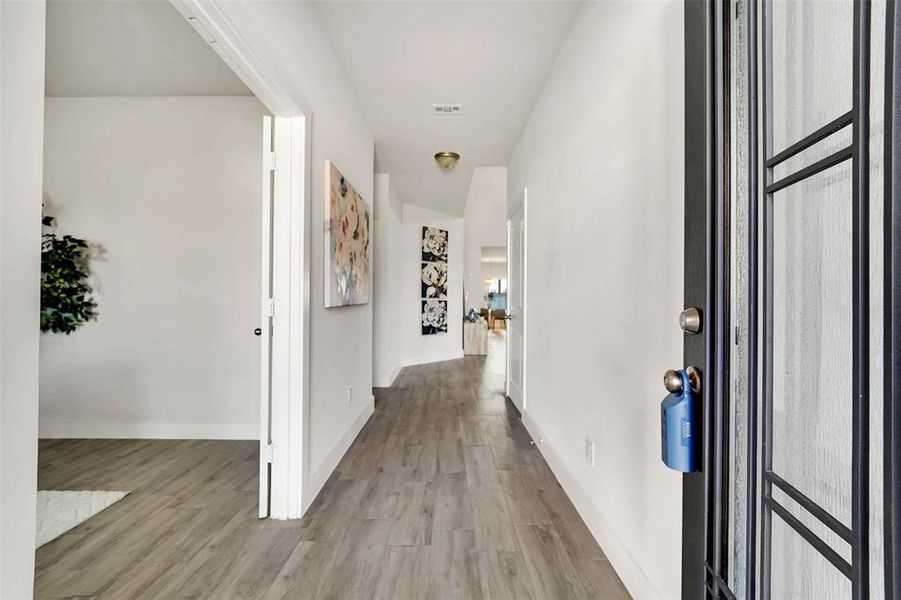 Corridor with light hardwood / wood-style floors