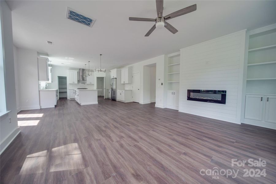 GREAT ROOM - BUILT IN SHELVING AND CEILING FAN!