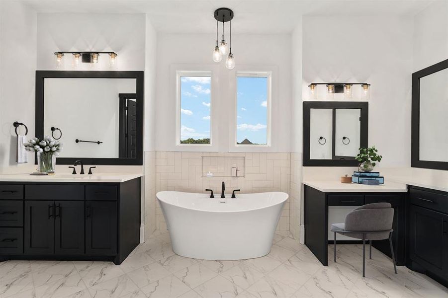 Dual vanities, diamond-lay flooring, stand-alone tub, makeup vanity. Checks all the boxes! *Virtually staged.