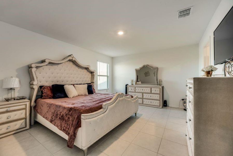 Bedroom featuring light tile patterned flooring