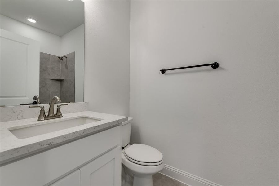 Bathroom with vanity and toilet