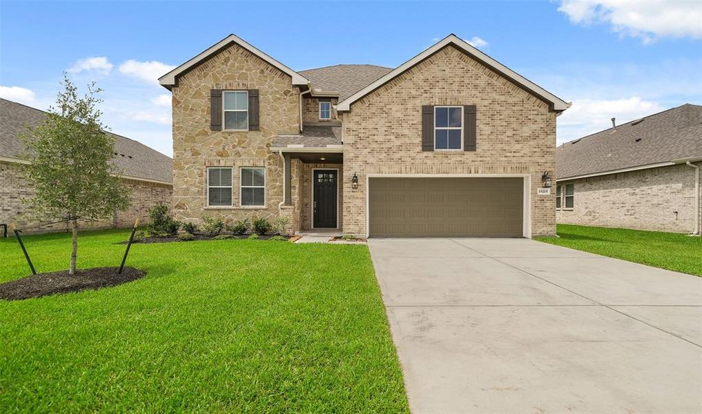 Stunning Omaha home design with elevation RA built by K. Hovnanian Homes in beautiful Centennial Oaks.