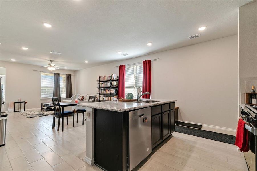 Kitchen with ceiling fan, stainless steel appliances, sink, and plenty of natural light