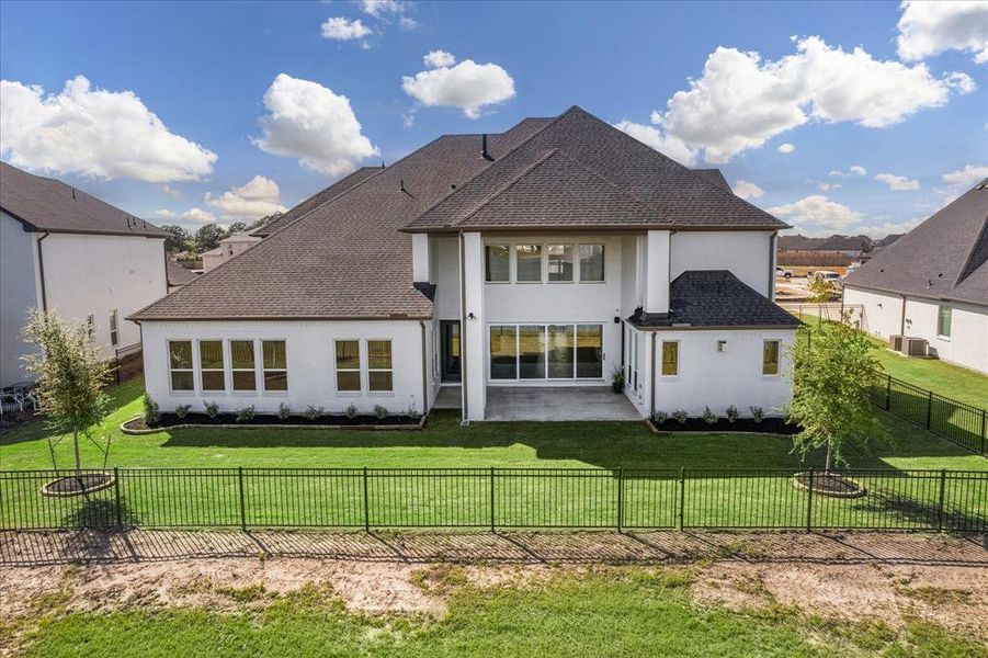 The two story covered patio overlooking the lake is quite impressive!