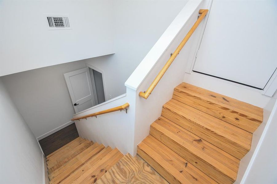 Private stairwell to the fully decked attic.