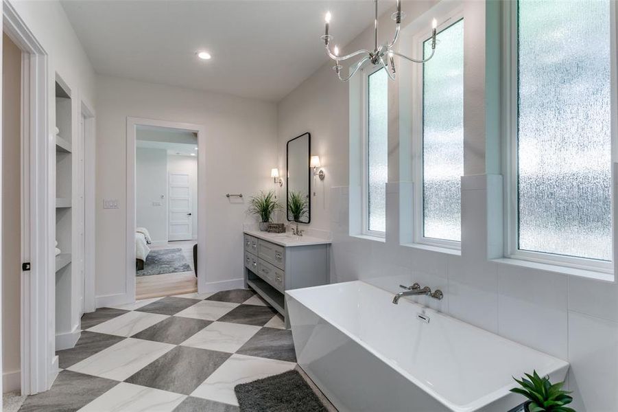 Bathroom featuring tile flooring, built in features, and vanity