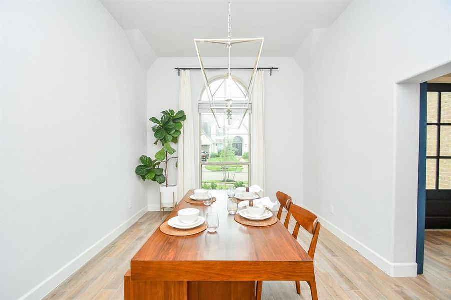 Spacious dining room off of the kitchen enclosed with a modern barn door.