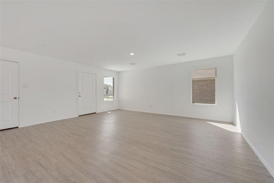 Unfurnished room featuring light wood-type flooring