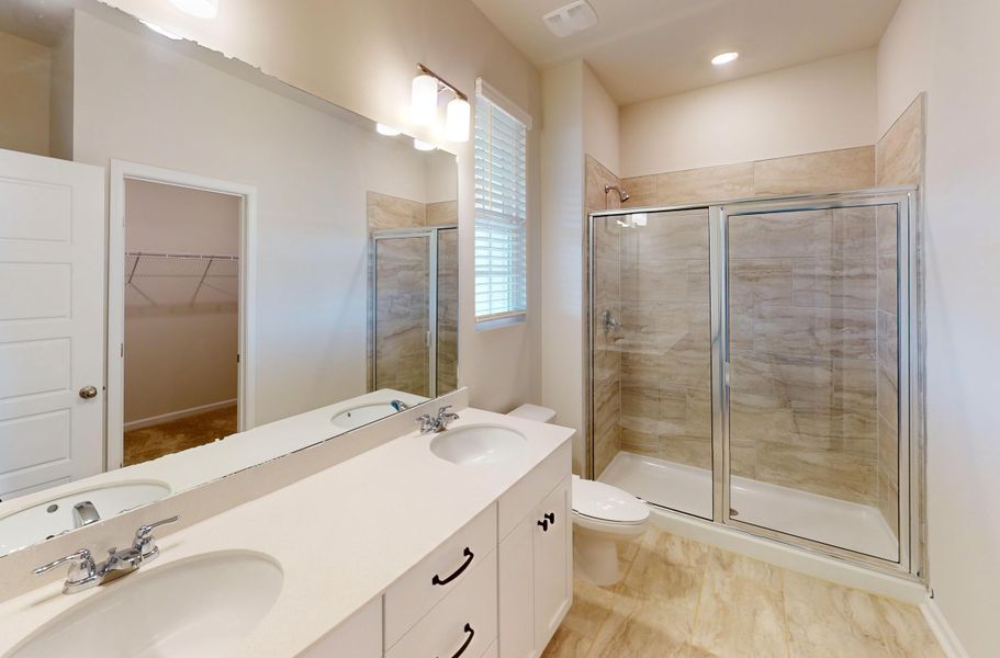 The Imperial plan first floor Owner's Suite bathroom features quartz countertops and dual vanities!