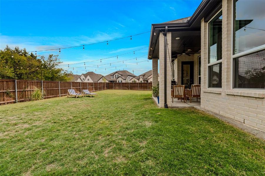 View of yard with a patio and ceiling fan