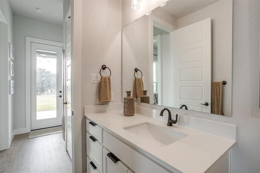 Bathroom featuring vanity and hardwood / wood-style flooring