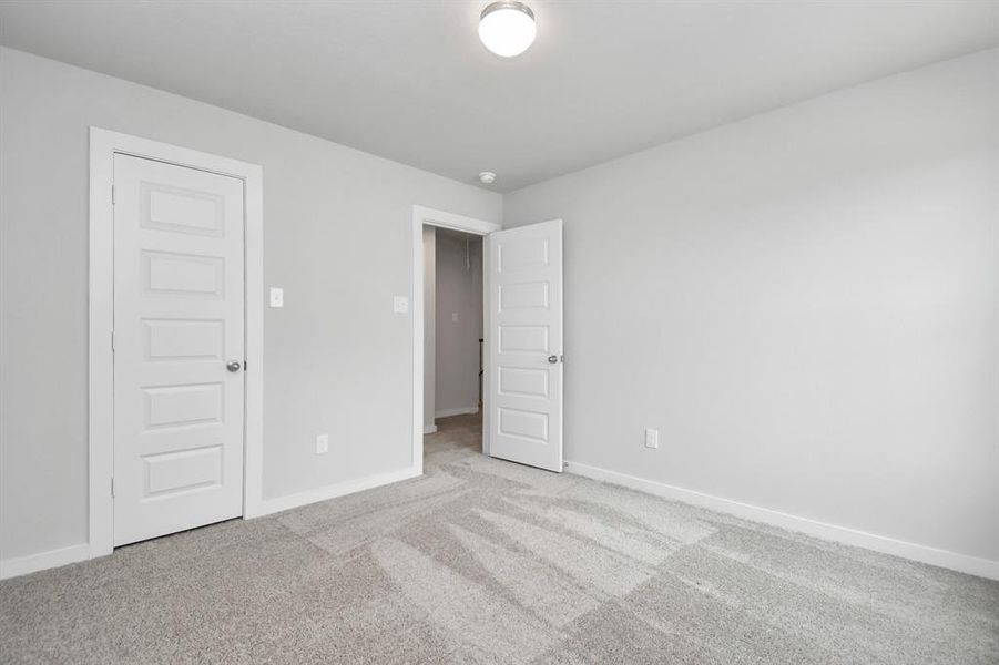 Generously sized secondary bedrooms, complete with spacious closets and soft, inviting carpeting.
