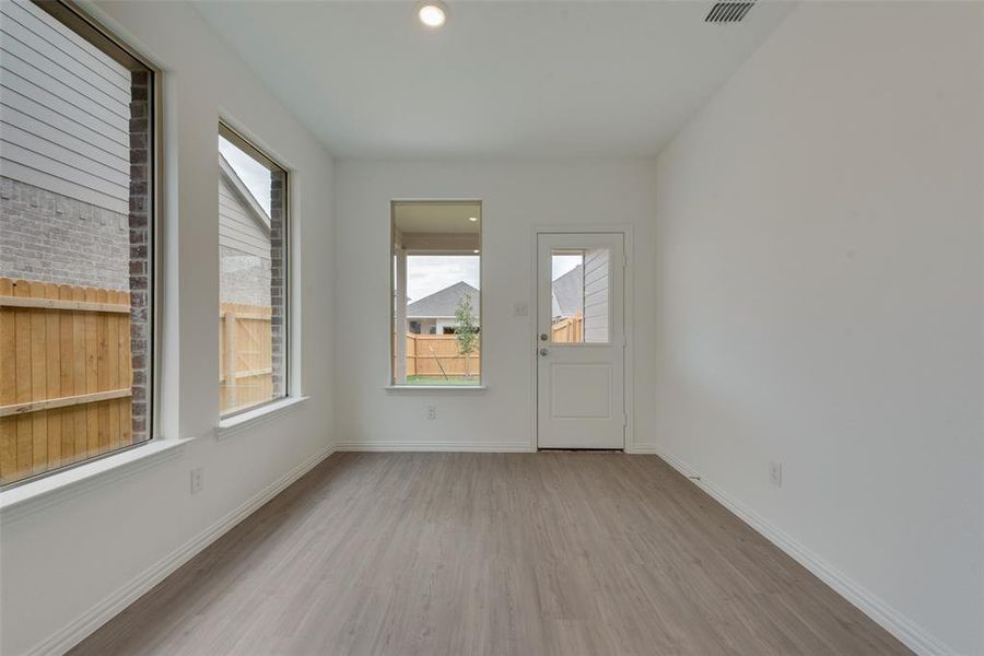 Unfurnished room with light hardwood / wood-style floors