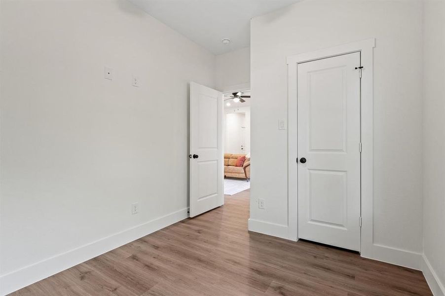 Unfurnished bedroom featuring light wood-type flooring