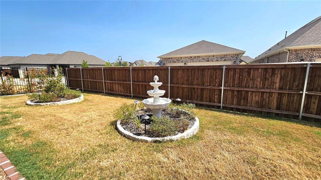 View of side yard with Fountain