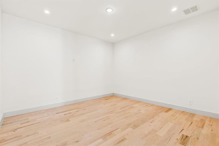 Empty room featuring light wood-type flooring