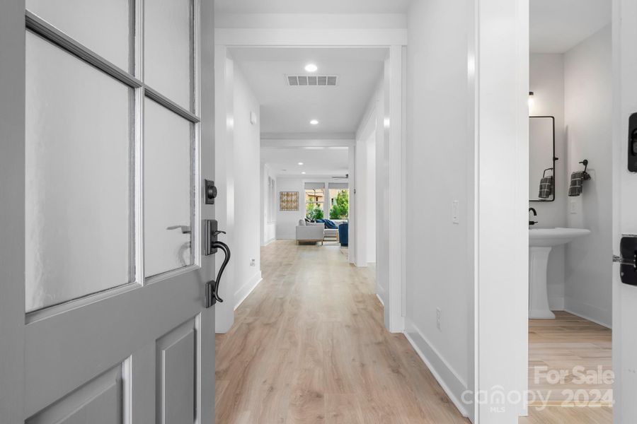 Foyer looking toward common areas.  Bedroom and full bath located to the right of the foyer.