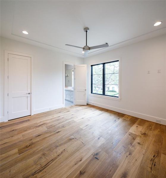 One of the four secondary En-suite guest bedrooms with views of the beautiful front yard trees