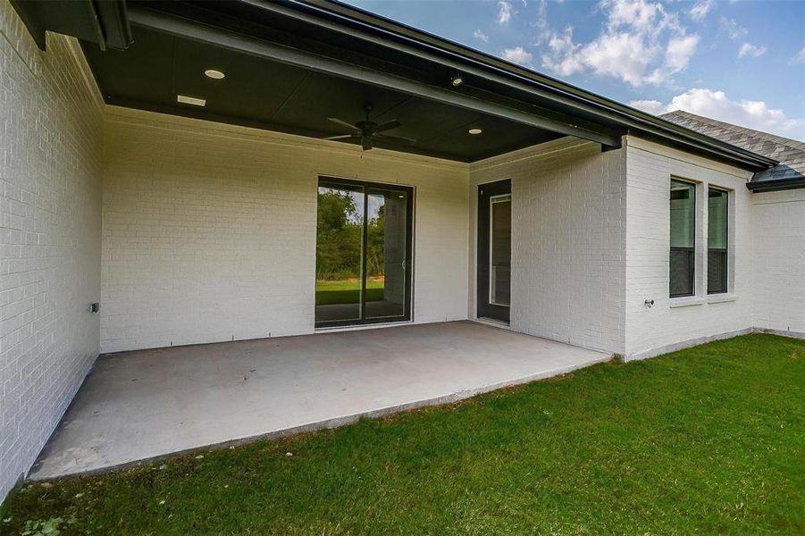 View of patio featuring ceiling fan