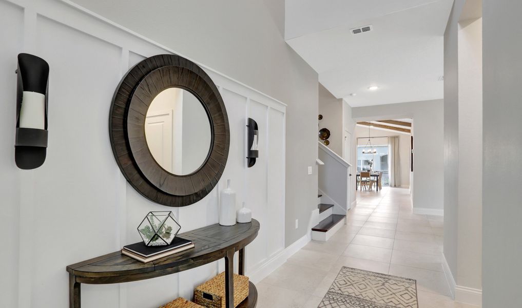 Welcoming foyer with decorative wall feature