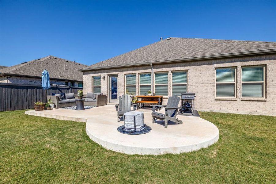 Back of house with a patio, an outdoor hangout area, and a yard