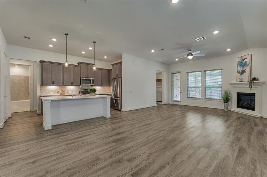 So much to love about this floor plan, including a private pass-through to the owner's retreat via hallway to the left of the backdoor.