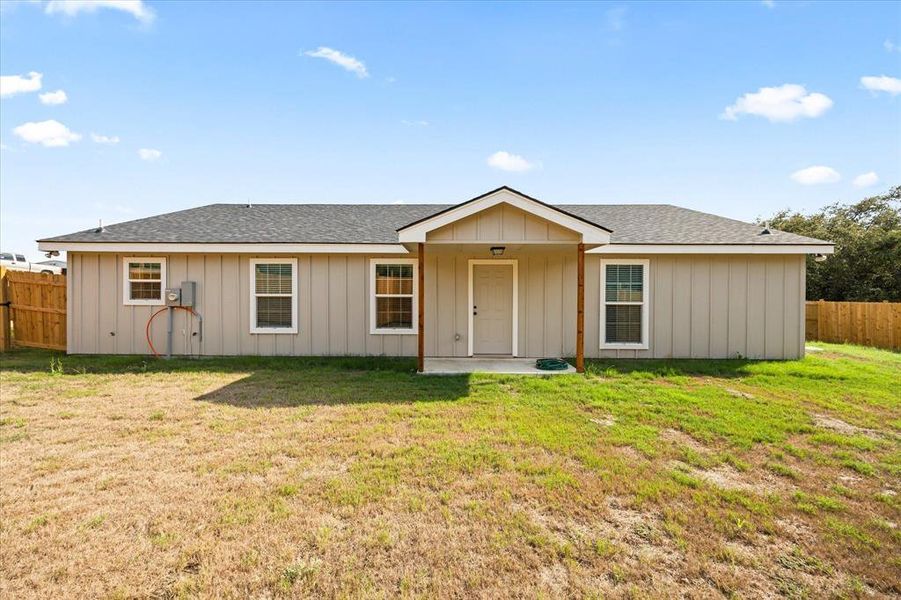 Ranch-style home with a front yard