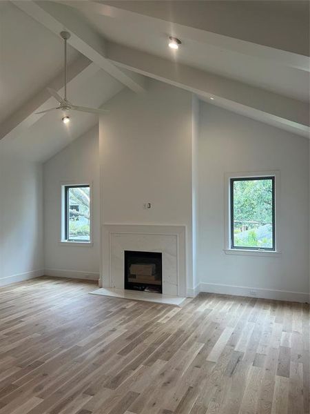 Primary bedroom with vaulted ceiling, gas fireplace and coffee bar.