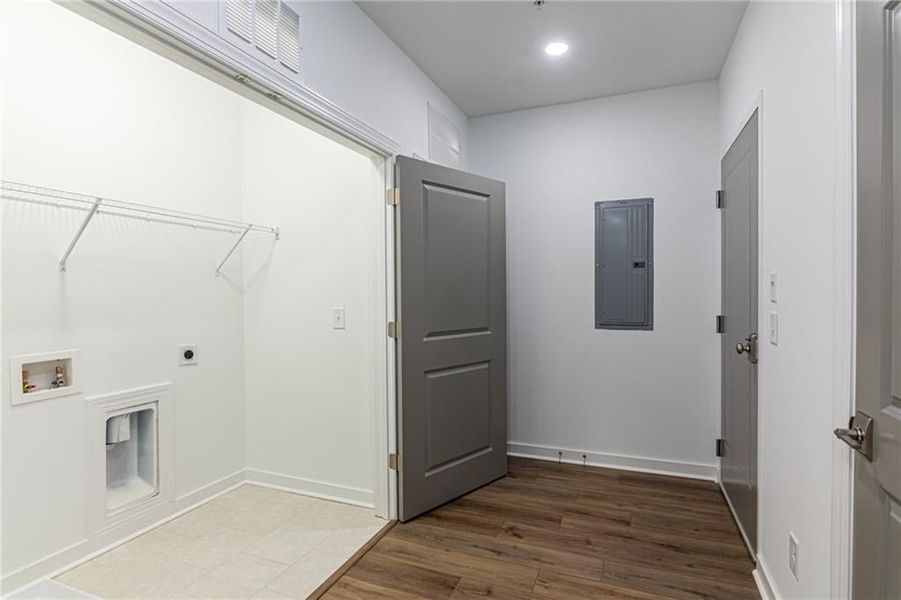 Side by side full size laundry area with shelving above.
*Not actual home-Representative purposes only*