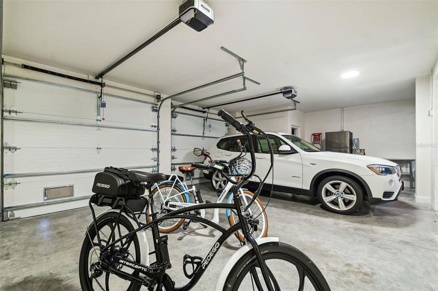 2 car garage with extra space and storage room in garage.