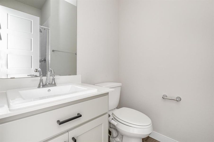 Bathroom featuring vanity and toilet