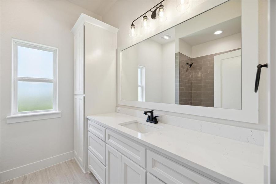 Bathroom with vanity and tile patterned flooring