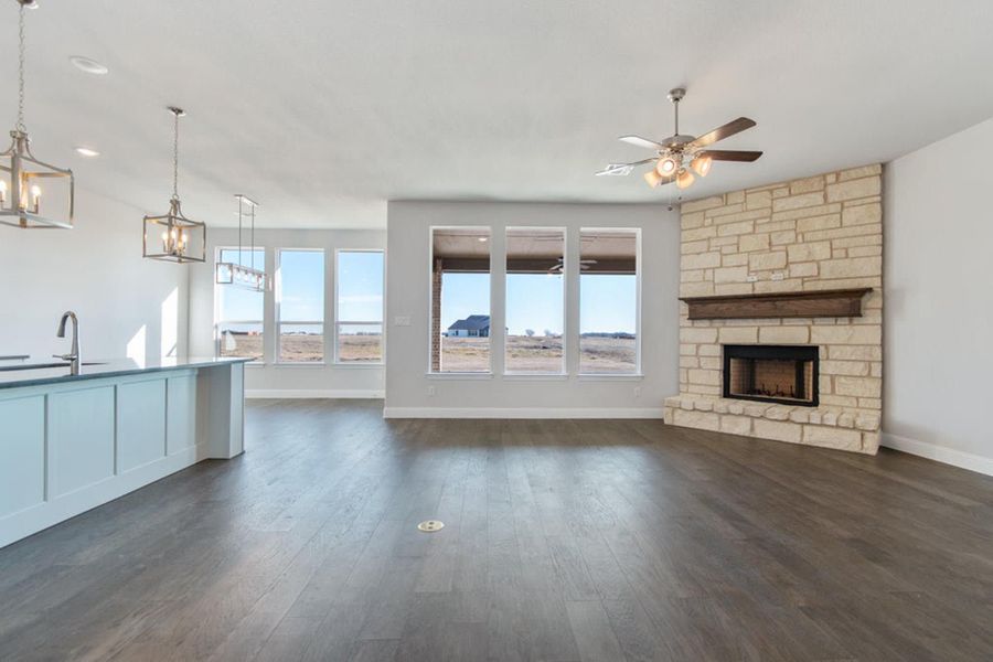 Family Room & Nook | Concept 2406 at Hidden Creek Estates in Van Alstyne, TX by Landsea Homes