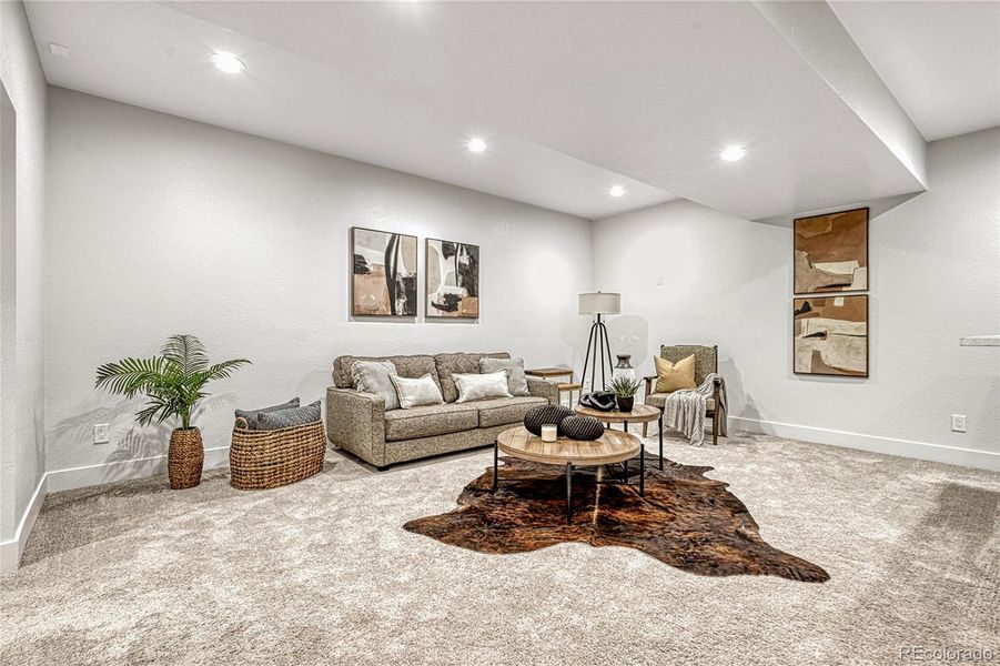 Head downstairs to your finished basement! The family offers plush carpet flooring and plenty of space for many different furniture design layout options!