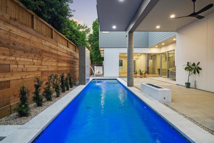 Beautifully designed backyard with Lap Pool and Summer Kitchen.
