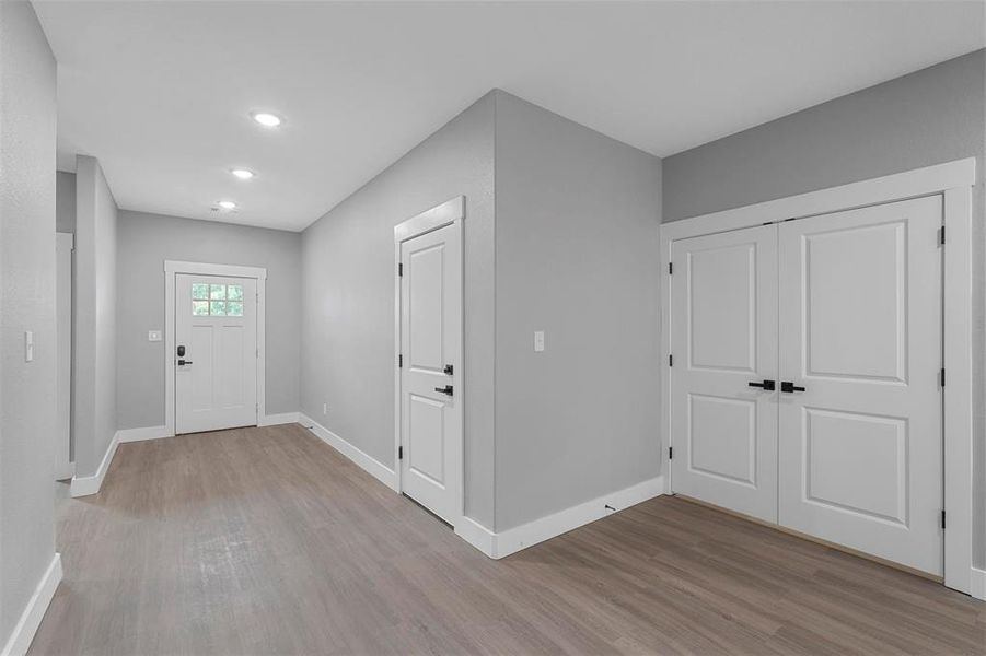 Foyer entrance featuring light hardwood / wood-style flooring