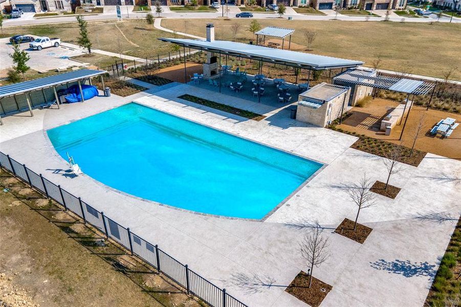 View of swimming pool featuring a patio area and a lawn