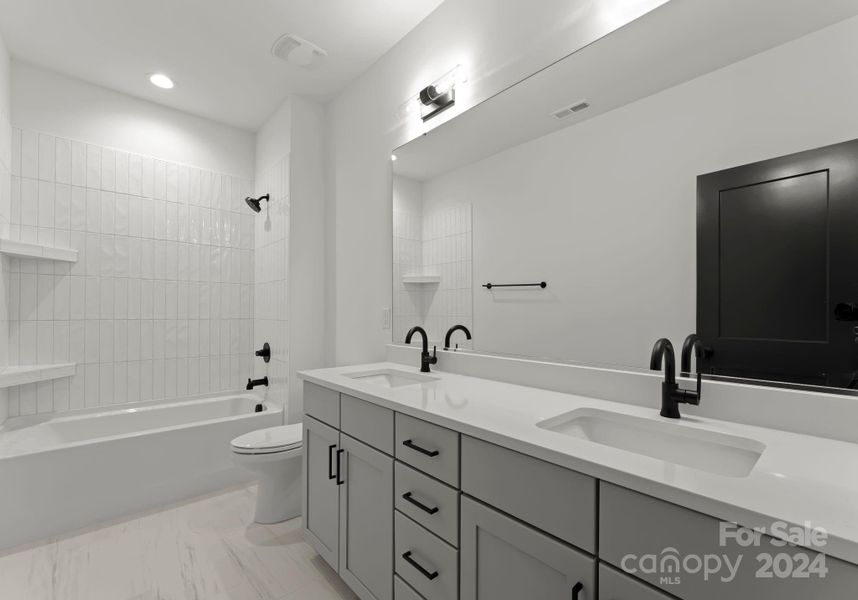 Secondary bathroom with dual sinks