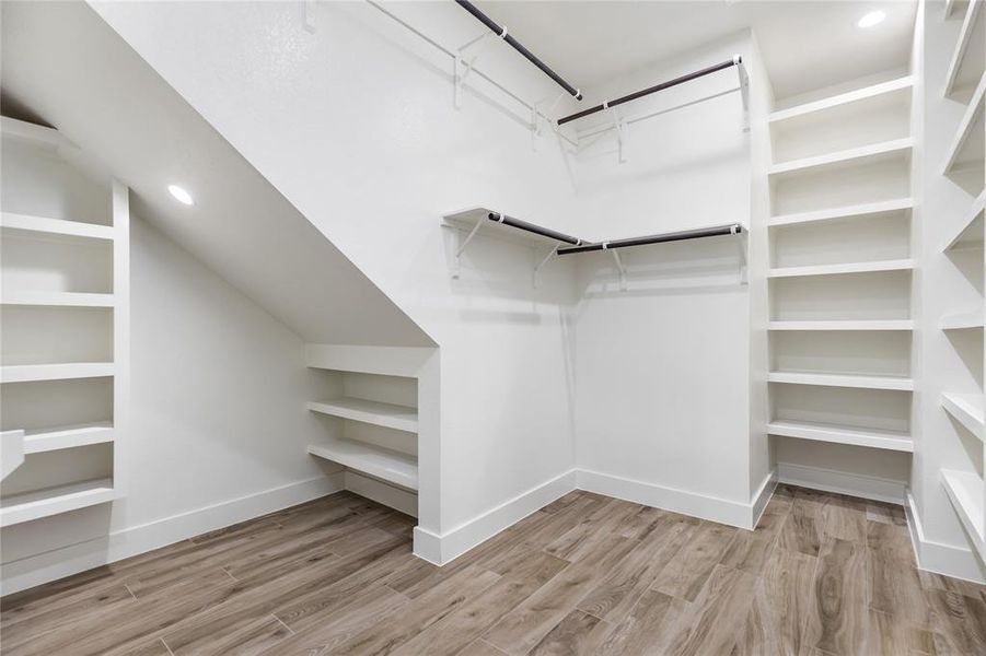 Look at the built-in storage in this Primary closet!