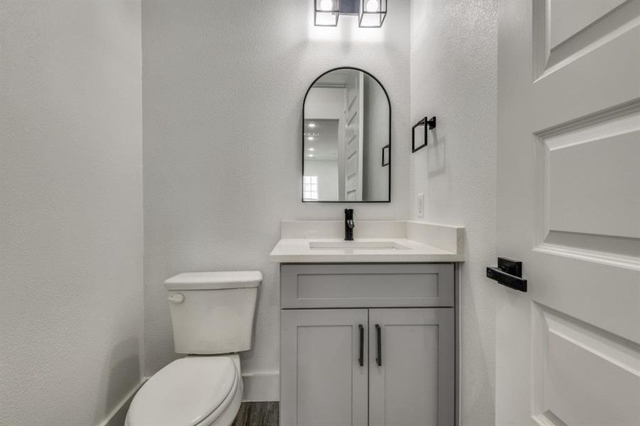 Bathroom with toilet and vanity