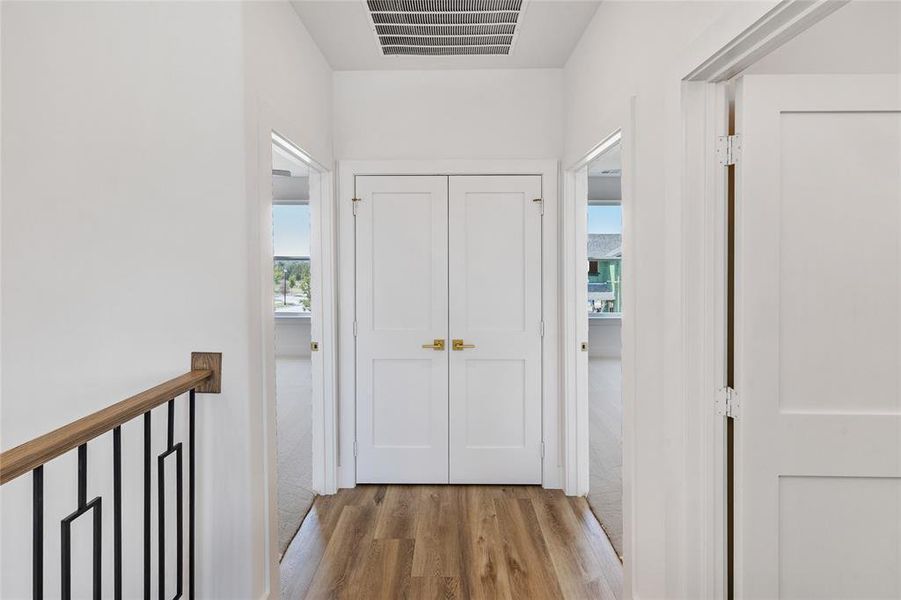 Corridor featuring light hardwood / wood-style flooring